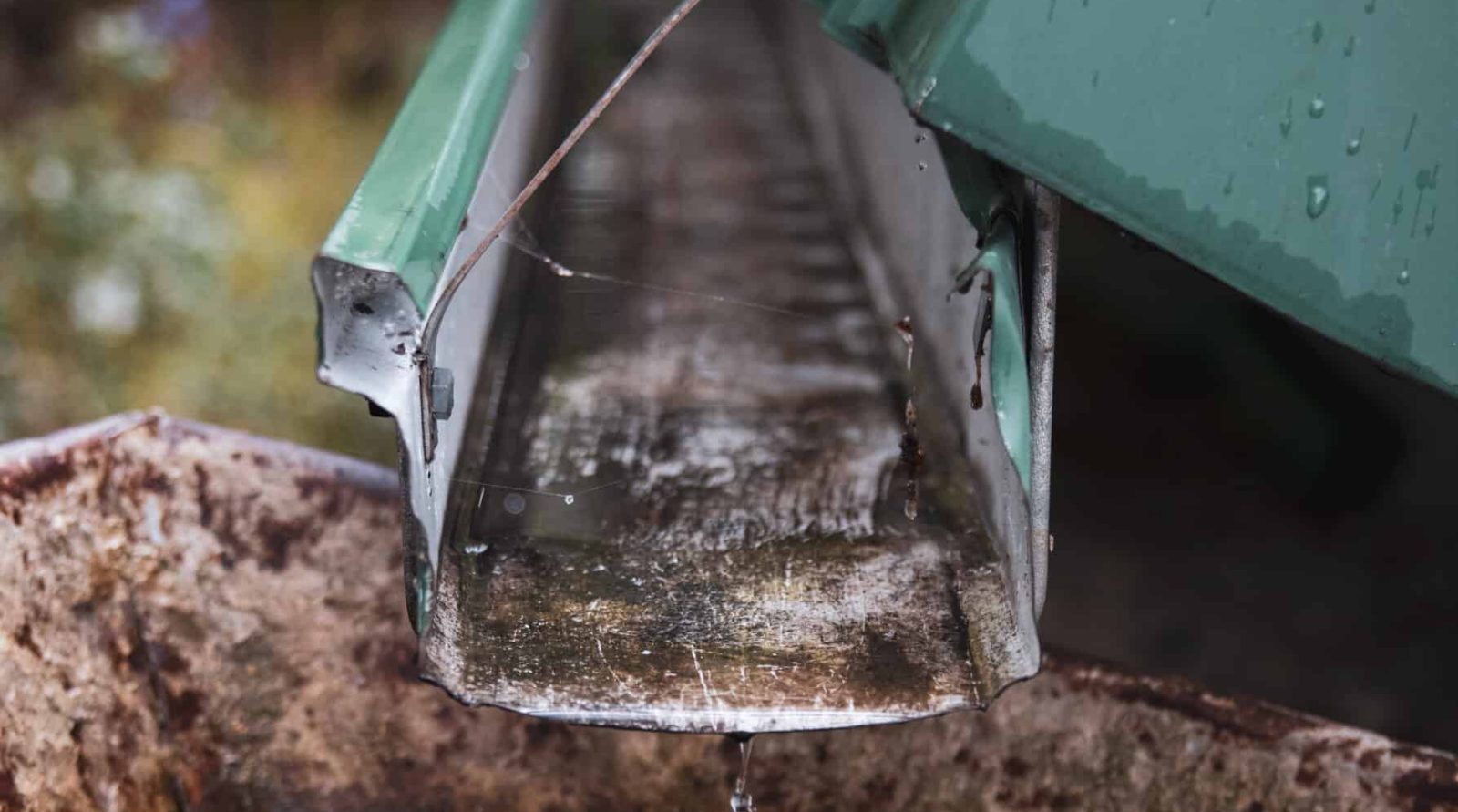 A vertical closeup of a roof drain pipe